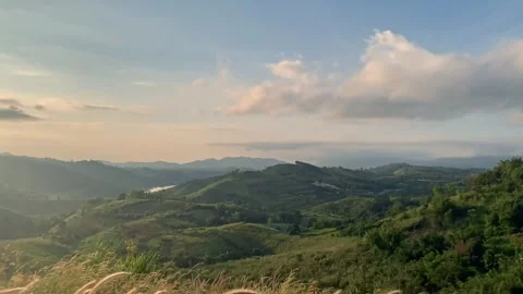 Slow motion meadow and cloud movement on mountain Stock Footage 256202147