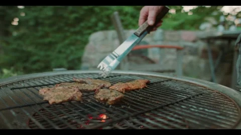 Slow Motion of Meat Being Grilled on a Charcoal Barbecue Video stock 342244241