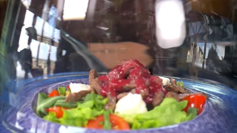 Slow motion. The meat salad under the glass cloche is filled with smoked smoke Stock Footage 154888301