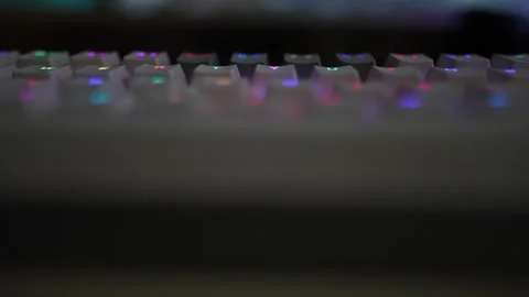 Slow motion mechanical RGB computer keyboard viewing footage Video stock 290946911