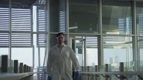 Slow motion of medic or scientist walking in futuristic looking lab or hospital Stock-Footage 112599304