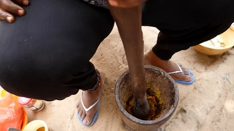 Slow motion medium shot of ingredients being crushed in mortar with pestle Stock Footage 116287222