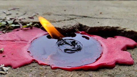 Slow Motion of a Melted Red Candle with an Outdoor Flame Stock Footage 304718317