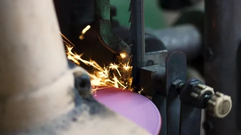 Slow Motion Metal Grinding on Bandsaw Blade with Spark Stream Stock Footage 337657816