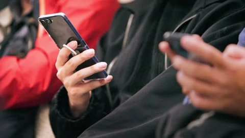 Slow motion of metro passenger holding smartphone Stock Footage 336637976