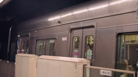 Slow motion of metro train arriving at platform in modern underground station Stock Footage 331189483