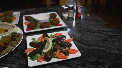 Slow-motion of middle eastern dishes with wine Stock Footage 129928083