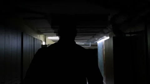 Slow motion mideo of man going to gym in the dark corridor Stock Footage 88545940