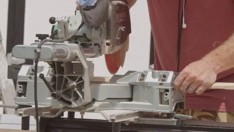 Slow motion Miter saw cutting a board for a DIY project Video stock 89874834