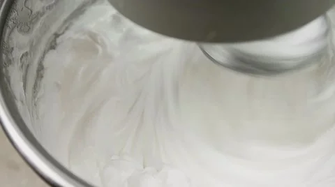 Slow motion, mixer whisking the egg whites to make cream Stock Footage 62425616