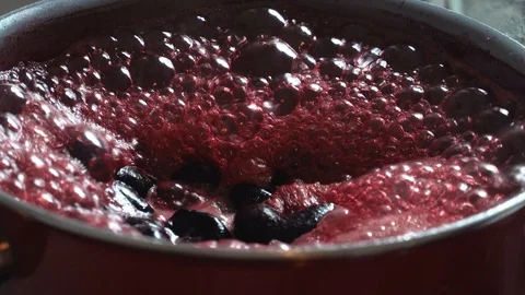 Slow motion. Mixing and kneading. Cooking Jabuticaba or jaboticaba jam. Stock Footage 128721990