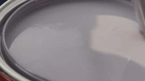 SLOW MOTION: Mixing a can of paint with a wooden stick Close Up Stock Footage 127597765