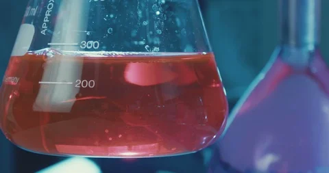 Slow motion of mixing chemicals inside a test tube Stock Footage 87794775