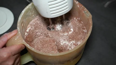Slow Motion Mixing Cocoa and Flour with Hand Mixer Video stock 320393515