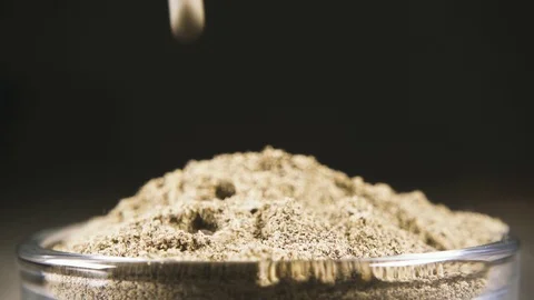 Slow motion a mixture of pepper peas falls into the black pepper close-up Stock-Footage 95793780