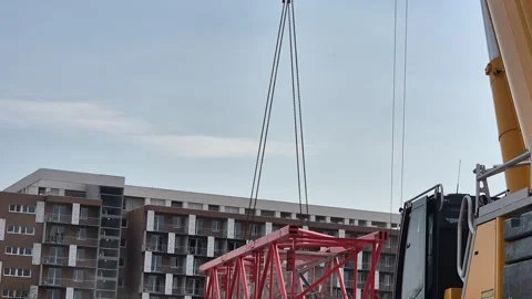 Slow Motion Mobile Crane Lifting Tower Crane Segment Vídeos de archivo 331537048