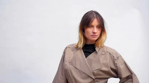Slow motion of a model with coat posing during a photo session Stockbeeldmateriaal 59738208