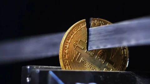 Slow Motion Model of Valuable Resource Bitcoin Cut by Saw Stock Footage