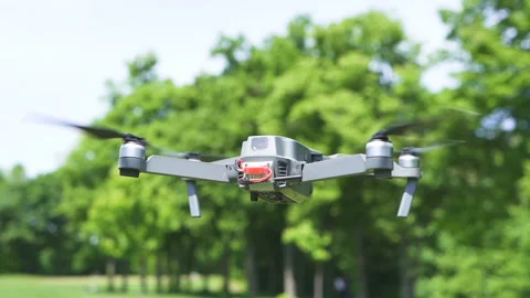 Slow motion. Modern drone fly against sky and branches .Scene 5 Stock Footage 108497339