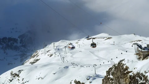 Slow motion of modern looking cabins going up cable railways in mountains Stock Footage 129092248