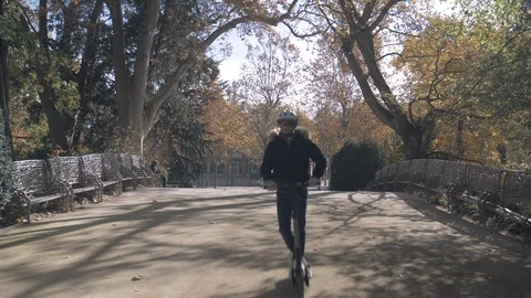 Slow Motion of Modern Man Crossing a Bridge on Electric Scooter 3 Vidéo 98757789
