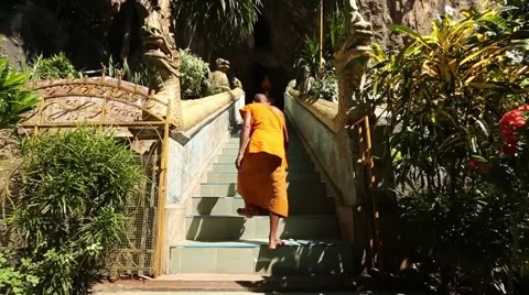 Slow Motion of Monk Walking Up Stairs 스톡 동영상 49773763