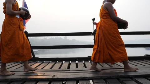 Slow-motion of Monk walking on Wooden bridge in Sangklaburi , Thailand. Stock Footage 106976376