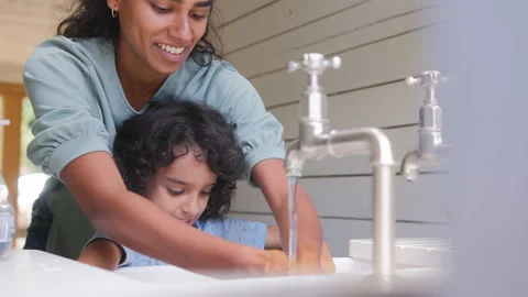 Slow motion of mother and son washing hands Stock Footage 162789710