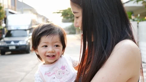 Slow-motion, mother throwing cute child in happy play time Stock Footage 87541778