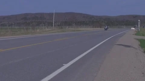 Slow motion motorcycle cruiser harley style in country Stock Footage 63074997