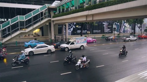Slow motion motorcyclists driving below overpass Stock Footage 81620527