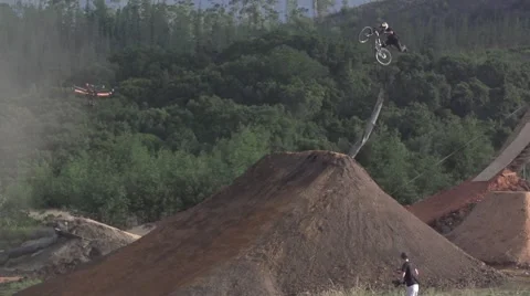 Slow Motion Mountain Biker Huge Trick with Drone Following Stock Footage 65062194