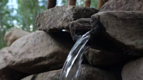 Slow motion mountain spring Asian style, woods，old asian spring water Video stock 154583645