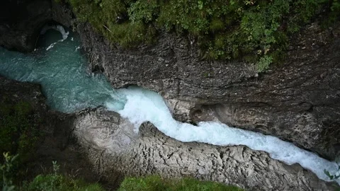 Slow motion of a mountain stream in a rocky gorge 스톡 동영상 260868859