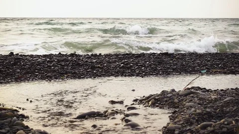 Slow motion the mouth of the river flows into the ocean Stock Footage 82614610