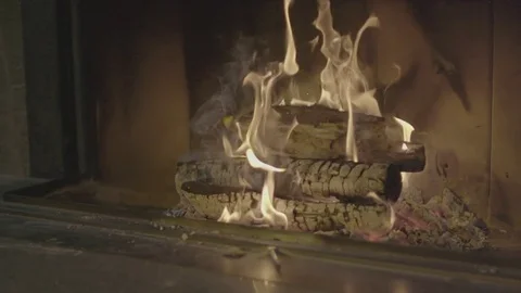 Slow motion move closer to fire in the fireplace Stockbeeldmateriaal 73352856