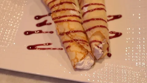 Slow motion move over strawberry creme crepes Stock Footage 107244472