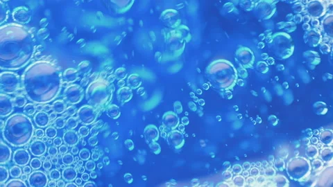 Slow motion. Movement of air bubbles. Air bubbles from deep blue water to the Stock Footage 170684313