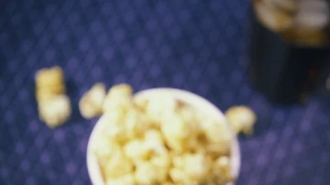 Slow motion movement of the camera in a soft focus on popcorn and cola Stock Footage 87880107