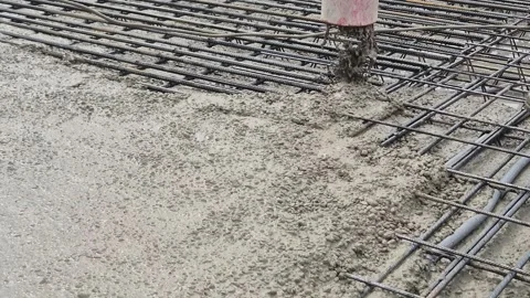Slow Motion Movement of Concrete Pump Discharge Hose Pouring Concrete Stock Footage 335709712