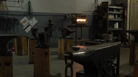 Slow Motion Movement through a Blacksmith Forge and Workshop Stock Footage 255408968