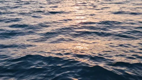 Slow motion movement of water surface ripples and waves at sunset, Water Stock Footage 276546155