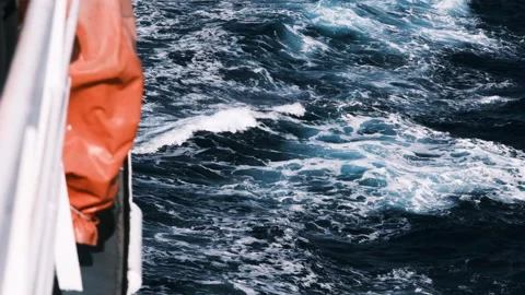 Slow motion movement of waves with blue water. Blue waves view from boat. Stock Footage 153953254