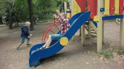 Slow motion, Moving the camera. Children play on the playground Stock-Footage 79535157