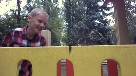 Slow motion, Moving the camera. Children playing on playground Video stock 79536931