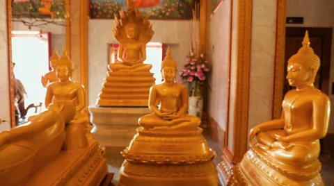 Slow motion moving in close on Images of Buddha in Temple Stock-Footage 56485952