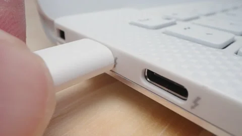 Slow motion moving shot of plugging USB type C cable into computer port Stock Footage 201316603