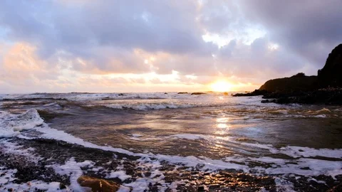 Slow motion moving shot of wave surge rushing up against coastal river during Vídeos de archivo 108608813