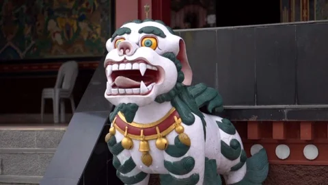 Slow motion moving towards tiger dragon statue in Nepal into mouth Stock Footage 91135941
