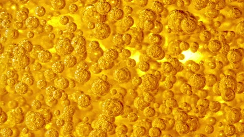 Slow Motion of Moving Yellow, gold Oil, Air Bubbles. Transparent cosmetic gel Video stock 224918919